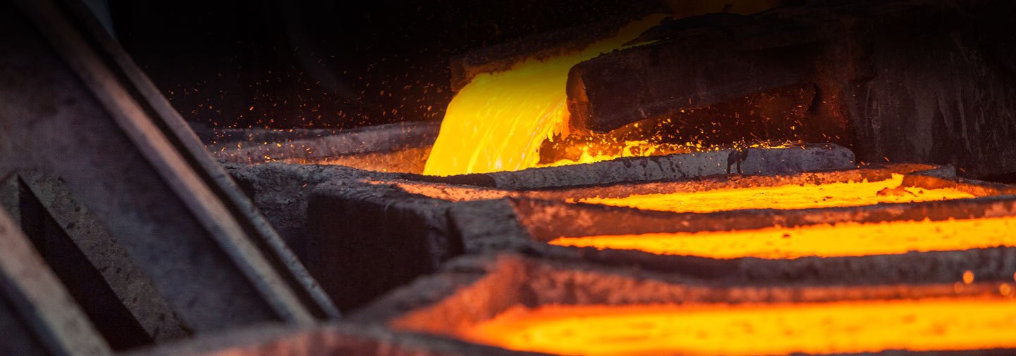 Molten metal flowing through a foundry casting line