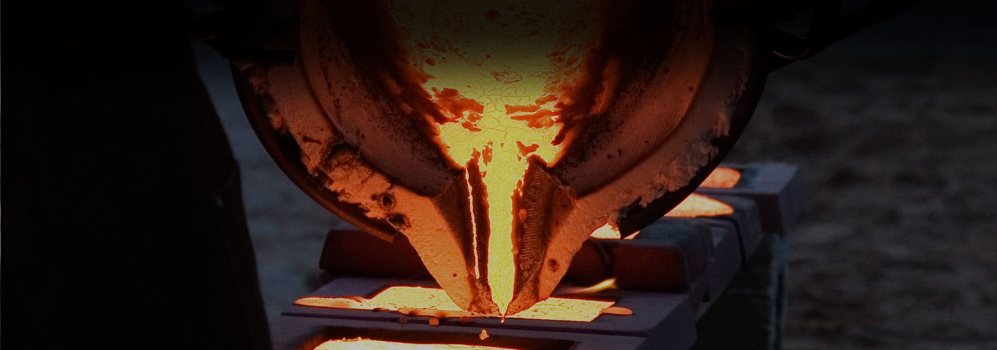 Molten metal being poured into a foundry mold